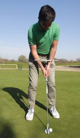 Golfer putting with T-Stroke